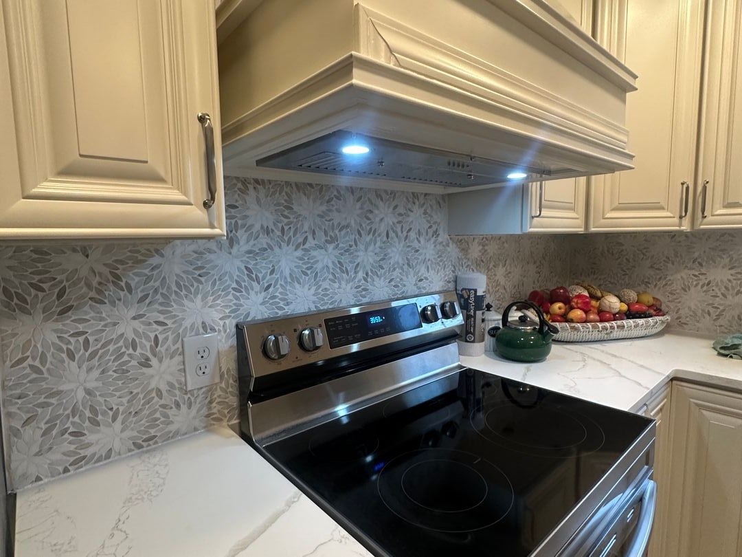 Second view of the completed cream cabinetry kitchen remodel